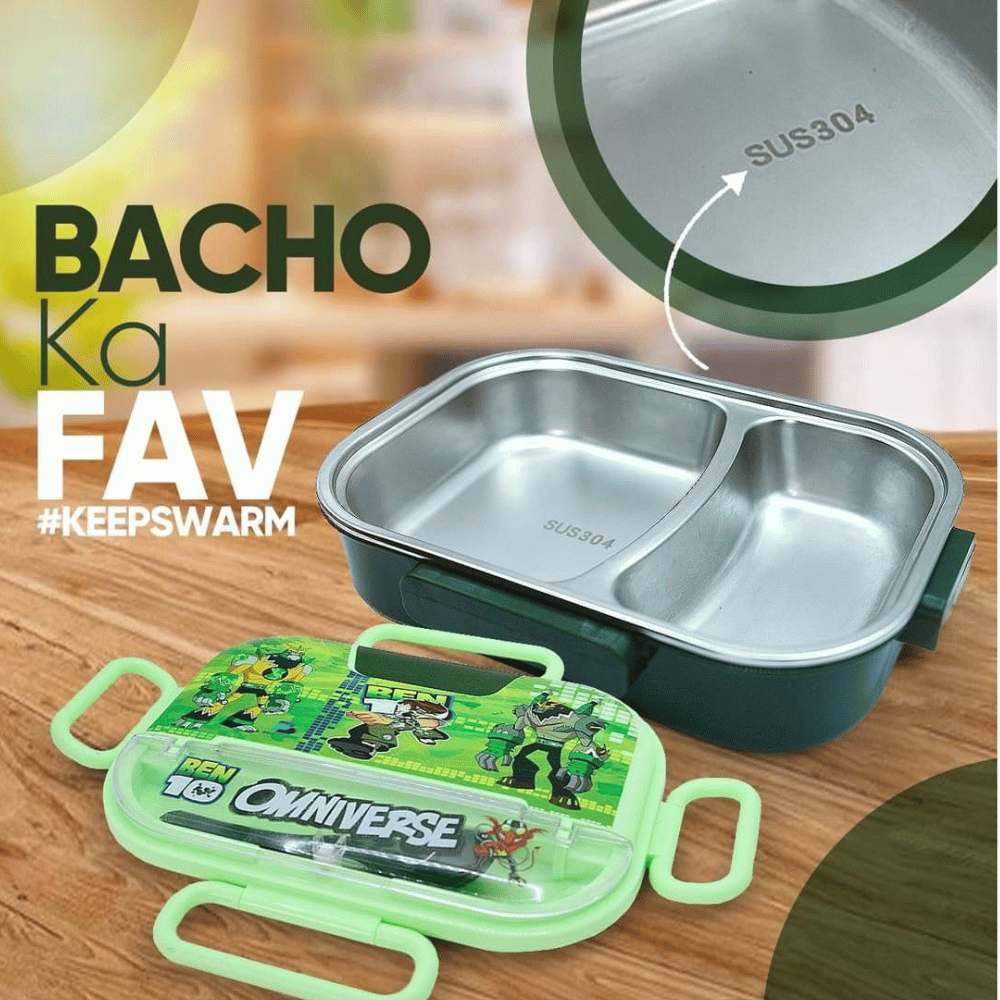 Stainless steel lunch box with green handle and cartoon design on a wooden surface