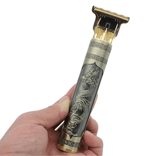 T9 Hair Trimmer held in hand to demonstrate its size and ergonomic design.