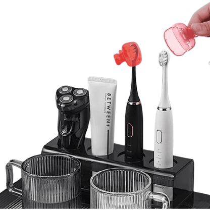 Side profile of a toothbrush placed on a stand, fitted with a cover