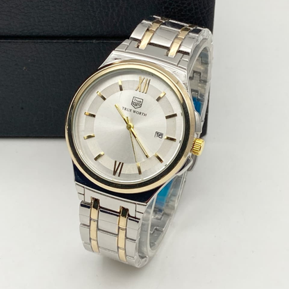 Silver and gold watch with white face on a light gray background