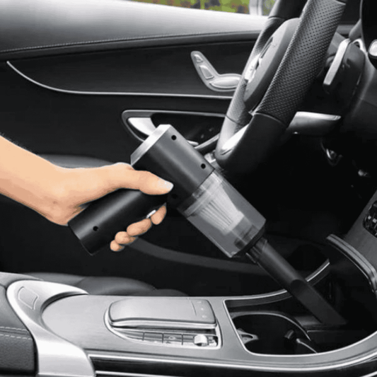 Left front view of the vacuum cleaner being used in a car