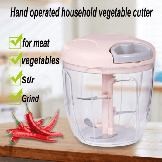 Hand-operated household vegetable cutter with text indicating its uses on a wooden surface.