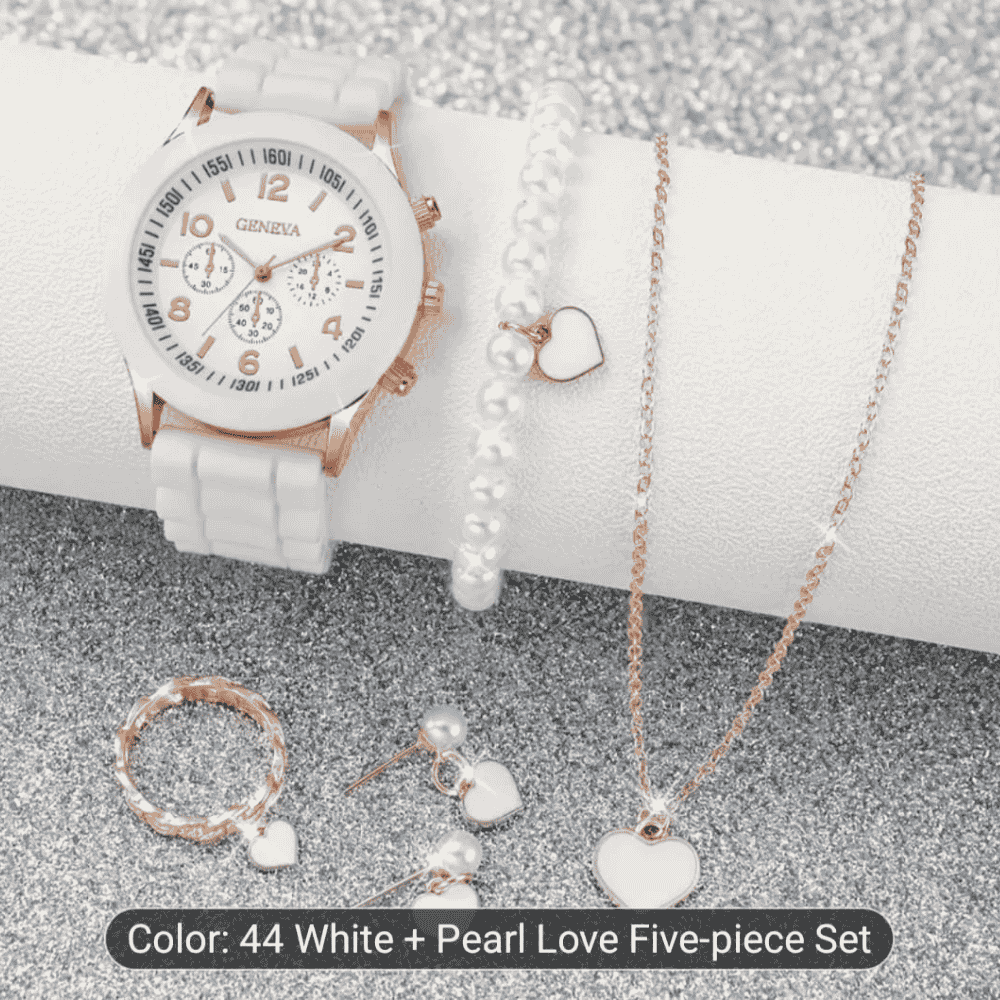 Upper view showing white watch with matching locket and earrings